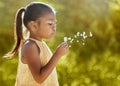 Child, girl or blowing dandelion flower in summer garden, nature park or sustainability environment in wish, hope or Royalty Free Stock Photo