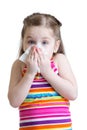 Child girl blowing his nose into handkerchief isolated on white background Royalty Free Stock Photo