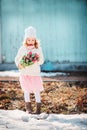 Child girl with bouquet of tulips having fun on the walk in early spring Royalty Free Stock Photo