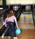 Child girl in with bowling ball. Royalty Free Stock Photo