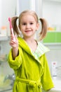 Child girl brushing teeth in bathroom Royalty Free Stock Photo