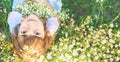Child girl in a camomile field. Selective focus Royalty Free Stock Photo