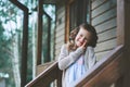 Child girl with candle holder relaxing in evening at cozy country house. Royalty Free Stock Photo