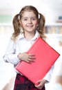 Child girl caucasian pupil hold folder school education. Royalty Free Stock Photo