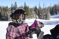 Child , girl, closeup riding snowmobile