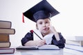 Child girl college graduate thinking about her perspectiv and future job. Humorous photo. Knowledge, studies, work, career Royalty Free Stock Photo