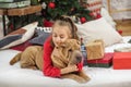 Child girl and dog at Christmas. Boxing Day. Shar Pei dog. Merry Christmas and Happy Holidays