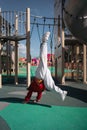 Child girl doing handstand on the outdoors playground. Funny active exercise Royalty Free Stock Photo