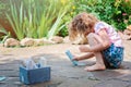 Child girl drawing with chalks in summer Royalty Free Stock Photo