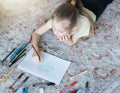 Child girl drawing with colorful pencils Royalty Free Stock Photo