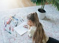 Child girl drawing with colorful pencils Royalty Free Stock Photo