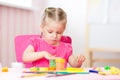 Child girl drawing and making by hands at nursey