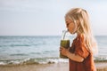 Child girl drinking smoothie vegan healthy lifestyle detox fruit beverage