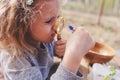 Child girl exploring nature in early spring forest. Kids learning to love nature. Teaching children about seasons changing. Royalty Free Stock Photo