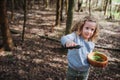 Child girl exploring nature in early spring forest. Kids learning to love nature. Teaching children about seasons changing. Royalty Free Stock Photo