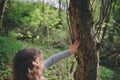 Child girl exploring nature in early spring forest. Kids learning to love nature. Teaching children about seasons changing. Royalty Free Stock Photo