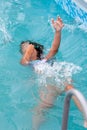 Child girl falls into the pool