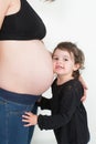 girl first daughter listen pregnant mother belly