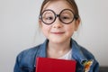 child girl in glasses with book textbook. portrait of student