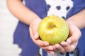 child girl green apple on white background Royalty Free Stock Photo