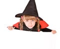 Child girl in Halloween witch costume with banner. Royalty Free Stock Photo