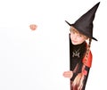 Child girl in Halloween witch costume with banner. Royalty Free Stock Photo