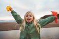 Child girl happy smiling walking outdoor family lifestyle vacations 4 years old kid playing with toys Royalty Free Stock Photo