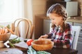 Child girl helps mom to cook and cut fresh vegetables for salad with knife Royalty Free Stock Photo