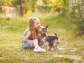 Child girl with her little Yorkshire terrier dog in the park Royalty Free Stock Photo