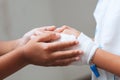 Child girl holding sick young sister hand