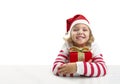 Child girl ib santa hat with christmas present on white background. Kid with gift box Royalty Free Stock Photo