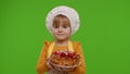 Child girl kid dressed as professional cook chef baker with tasty strawberry pie on chroma key Royalty Free Stock Photo