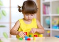 Child girl kid playing with sorter toys Royalty Free Stock Photo