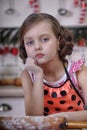 Child girl in the kitchen Royalty Free Stock Photo