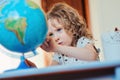 Child girl learning with globe at home Royalty Free Stock Photo