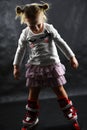 Child girl is learning to roller skate Royalty Free Stock Photo