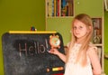 Child girl learning to write on drawing board at home Royalty Free Stock Photo