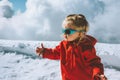Child girl outdoor travel in winter mountains baby 2 year old healthy active lifestyle Royalty Free Stock Photo