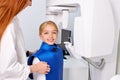 child girl patient doing panoramic teeth x-ray orthopantomography in clinic Royalty Free Stock Photo