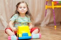 Child girl playing with a toy car on floor Royalty Free Stock Photo