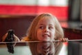 Child girl playing toy horse indoors. Childhood child toys