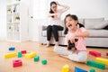 Child girl playing video games having fun