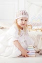 Child girl playing with a wooden toy pyramid. Little cute girl with  natural toys Royalty Free Stock Photo