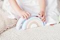 Child girl playing with a wooden toy pyramid. Little cute girl with  natural toys.  Close up picture Royalty Free Stock Photo