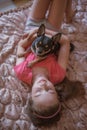 Child girl plays with little dog black hairy chihuahua doggy Royalty Free Stock Photo