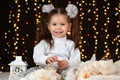 Child girl portrait in christmas decoration, happy emotions, winter holiday concept, dark background with illumination and boke li Royalty Free Stock Photo