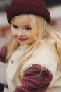 Child girl portrait stylish kid wearing hat and fluffy sherpa jacket winter fashion clothing