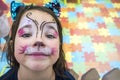 Child girl posing face painted during at Children Playroom