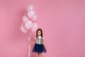 Child girl posing with pastel pink air balloons Royalty Free Stock Photo