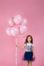 Child girl posing with pastel pink air balloons Royalty Free Stock Photo